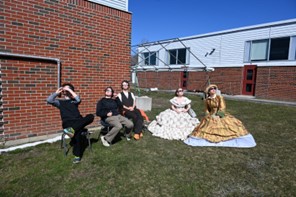 students viewing the eclipse in theater costumes