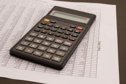 budget paper work and calculator