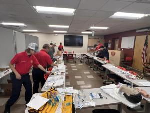 Fire-EMS staff prepare packets for Fire Prevention Week