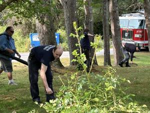 Fire EMS assist with yard work for lifetime members