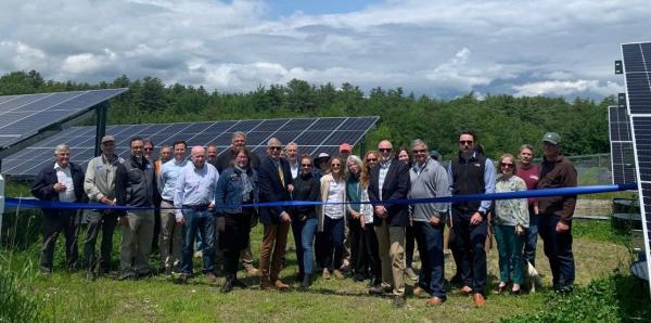 Attendees gathered at solar array for for ribbon cutting