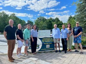 Councilors present check to Twombly Pond