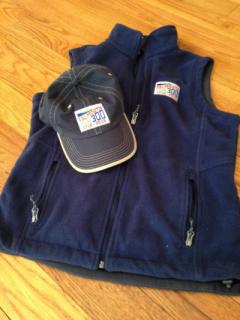 Falmouth300 navy fleece and navy ball cap with full color Falmouth300 embroidered logos